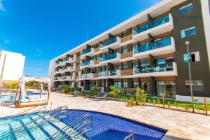 A piscina localizada em Mana Beach #C112 - Para 3 Pessoas por Carpediem ou nos arredores