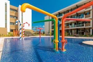 A piscina localizada em Mana Beach #C112 - Para 3 Pessoas por Carpediem ou nos arredores