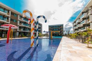 A piscina localizada em Mana Beach #C112 - Para 3 Pessoas por Carpediem ou nos arredores
