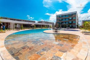 A piscina localizada em Mana Beach #C112 - Para 3 Pessoas por Carpediem ou nos arredores