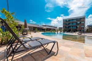 A piscina localizada em Mana Beach #C112 - Para 3 Pessoas por Carpediem ou nos arredores