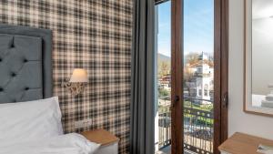 Posteľ alebo postele v izbe v ubytovaní Brettania Hotel