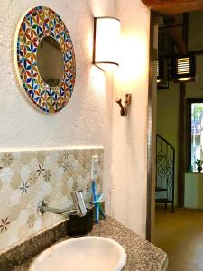 a bathroom with a sink and a mirror on the wall at Gaia Eco Glamping - Instituto Almas Livres in Arraial d'Ajuda