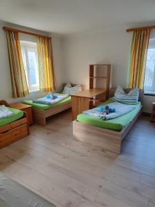 מיטה או מיטות בחדר ב-Amtmannhaus Ferienunterkunft