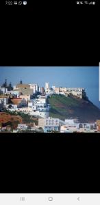a view of a city with buildings on a hill at El barandilla in Sidi Ifni