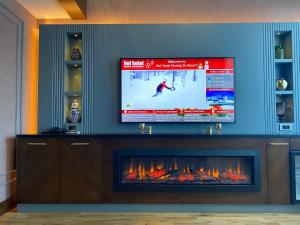 Bof Hotels Uludağ Ski&Luxury Resort All Inclusiveにあるテレビまたはエンターテインメントセンター