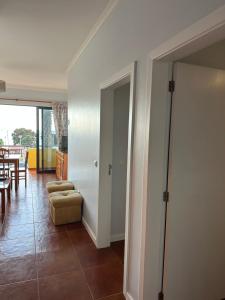 a living room with a couch and a table at Apartamentos Amarelo in Caniçal