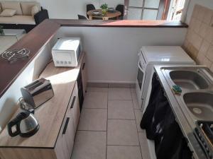 Kuchyň nebo kuchyňský kout v ubytování Appartement Mezzanine + 14 fotografií