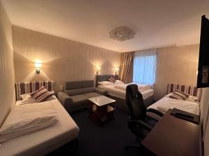 Postel nebo postele na pokoji v ubytování Hotel Austria