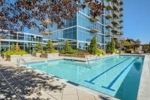 a swimming pool in front of a building at 1700 Bassett, Unit 818 in Denver