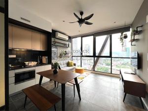 a kitchen and living room with a ceiling fan at Scarletz Suites by Edenzpace @ KLCC Area in Kuala Lumpur