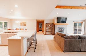 a kitchen and living room with a couch and a table at 310 Vista Drive in Ridgway