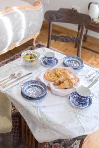 a table with blue and white plates of food on it at The Rear of the Plough,Everdon. in Daventry