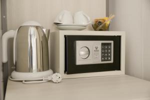 a microwave on a counter with a coffee maker at Romerooms in Rome