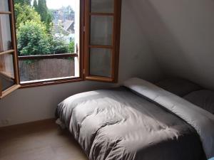 Łóżko lub łóżka w pokoju w obiekcie AUTHENTIQUE MAISON DE PECHEUR ENTRE-TERRE & MER Avec Un POÊLE À BOIS A Disposition