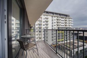 a balcony with a view of a building at Duet Noir in Oradea