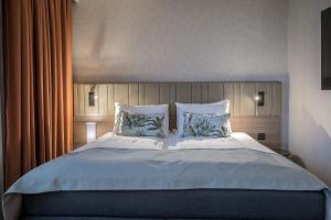 Postel nebo postele na pokoji v ubytování Quality Hotel Prinsen