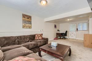 a living room with a couch and a table at 7213 S Tamarac St in Centennial