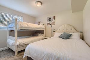 a bedroom with two bunk beds and a window at 7213 S Tamarac St in Centennial