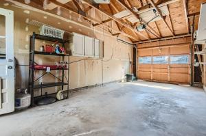 a large room with a garage with a room with a garage at 7213 S Tamarac St in Centennial