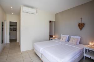 Postelja oz. postelje v sobi nastanitve Boca Gentil sea view apartment - Jan Thiel