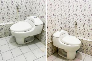 uma casa de banho com um WC branco num quarto em OYO 92060 We Bro Kost em Kupang