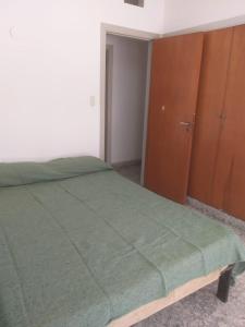 Una cama o camas en una habitación de ALQUILER DE CASA POR TEMPORADA