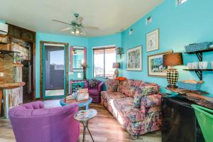 a living room with purple furniture and blue walls at Sedona Studio with Amazing View and On-Site Hiking! in Sedona