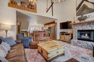 a living room with a couch and a fireplace at Village Point in Breckenridge
