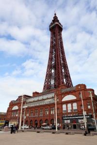 a red brick building with a tower on top of it at Pine Studio in Blackpool