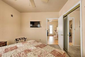 a bedroom with a bed and a flat screen tv at Williams Vacation Rental with Mountain View! in Williams