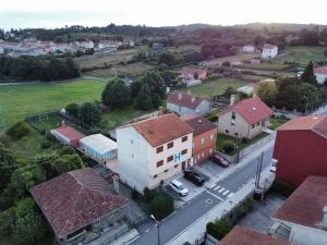 an aerial view of a small town with houses and a street at Hospedaje Jose Rey in Santiago de Compostela