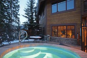a small swimming pool in front of a house at Mountain Thunder #604 in Breckenridge