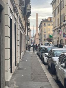 a street with cars parked on the side of the road at Lila House in Turin +3 photos