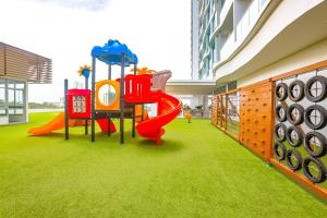 a playground with a slide in a building at Condo Gorgona Beach Apartamento de Lujo de 2 Habitaciones in Chame