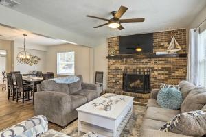a living room with a couch and a fireplace at Pet-Friendly Gulfport Home Less Than 2 Mi to Beach in St Petersburg