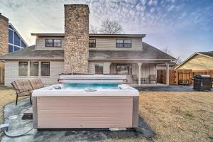 a hot tub in the backyard of a house at Immaculate Woodland View Retreat with Hot Tub in Tulsa
