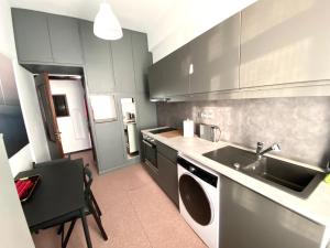 A kitchen or kitchenette at Classic 2 Bedroom Apartment Next to Metro - Marousi