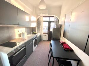 A kitchen or kitchenette at Classic 2 Bedroom Apartment Next to Metro - Marousi