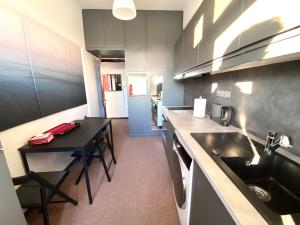 A kitchen or kitchenette at Classic 2 Bedroom Apartment Next to Metro - Marousi