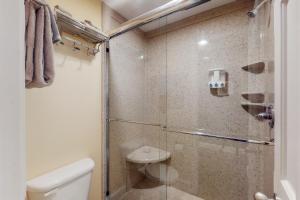 a bathroom with a glass shower with a toilet at Bella Paradiso 11 in Eureka Springs