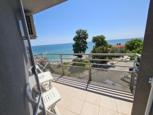 a balcony with a view of the ocean at Hotel Mida in Obzor