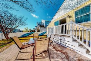 a deck with two chairs and a table at Town of South Bethany --- 108 Brandywine Dr in Bethany Beach