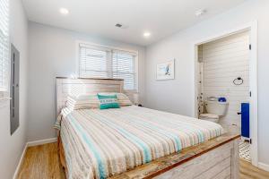 a bedroom with a bed and a toilet at Town of South Bethany --- 108 Brandywine Dr in Bethany Beach
