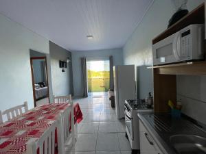 A kitchen or kitchenette at Cabanas do Ribeiro