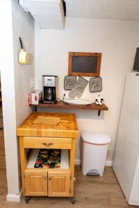 a kitchen with a table with a coffee maker on it at Cozy & Comfy Cottage in the City - w parking in Pittsburgh