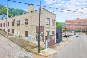 an old brick building on the side of a street at Trendy & Hip South Side Studio Walk to Downtown in Pittsburgh