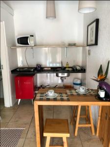 Η κουζίνα ή μικρή κουζίνα στο Pousada Sol do Rosa +88 φωτογραφίες
