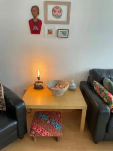 a living room with a coffee table and a couch at Charming 3 Bedroom Apartment in the Heart of Vibrant Old Town in Edinburgh