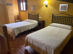 Posteľ alebo postele v izbe v ubytovaní CR lagunas de Ruidera Sin piscina